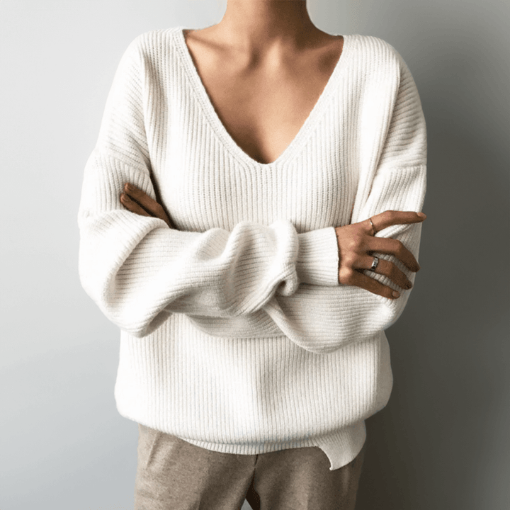 Casual women's V-neck sweater with a relaxed fit & soft knit texture.