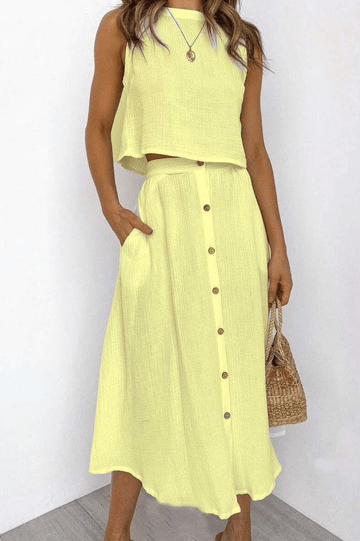 Versatile women's two-piece midi skirt and relaxed top set, ideal for casual elegant spring & summer.