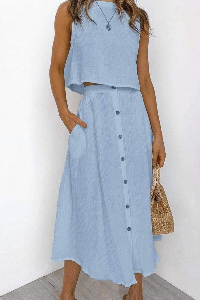 Chic women's co-ord set featuring a relaxed round neck top and a flowy midi skirt for effortless style.