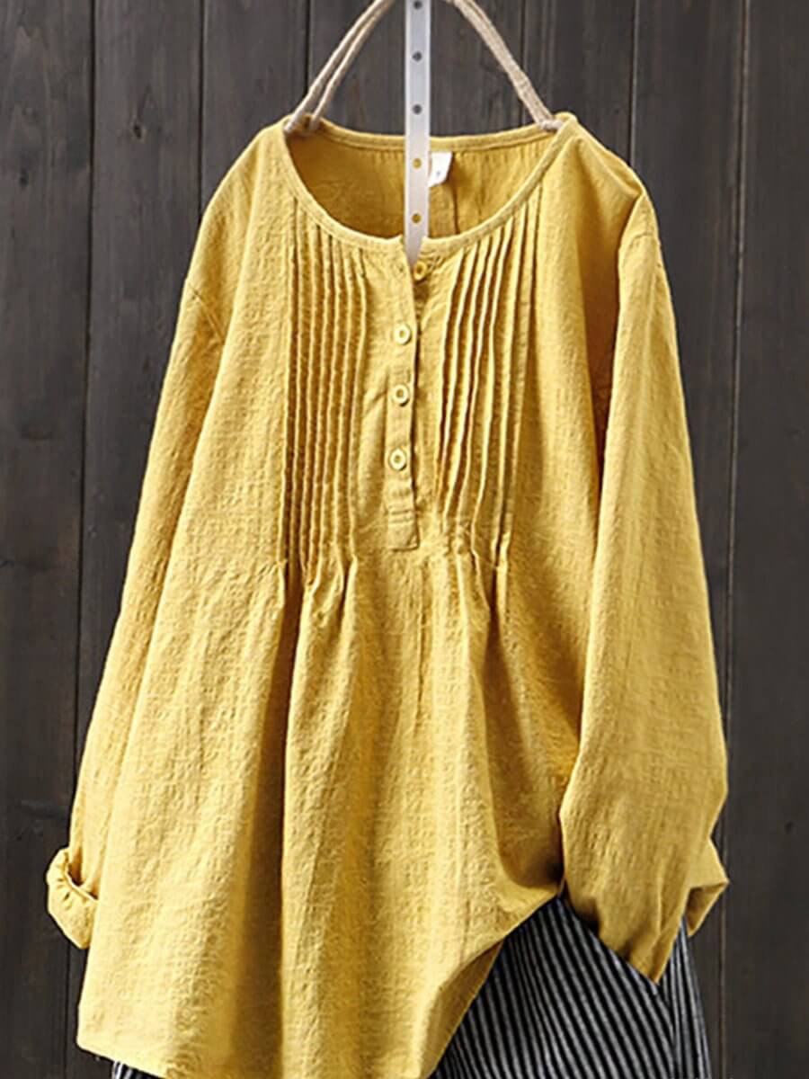 Vintage style women's retro cotton linen shirt. Loose fit, long sleeve casual blouse with button-down design.