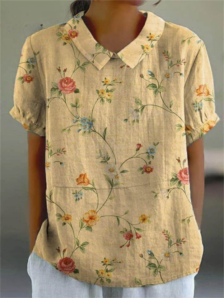 Loose fit women's retro floral cotton-linen shirt, elegant and breathable for effortless summer style.