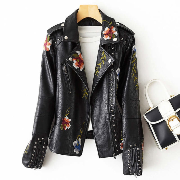 Close-up of a women's retro floral print jacket, showcasing its unique vintage pattern. Fashionable outerwear.