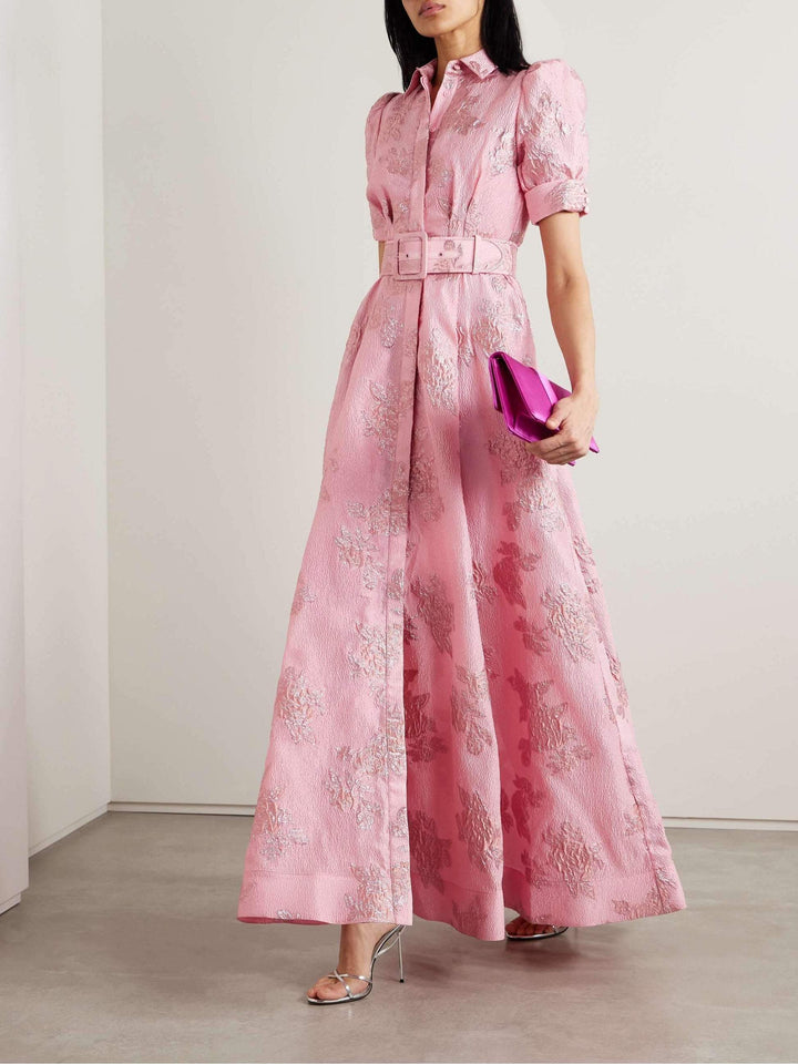 Sophisticated women's pink retro dress with lapel and high waist. Elegant vintage fashion for spring events.