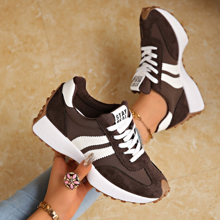 Back view of comfortable women's retro sneakers, highlighting the chunky platform sole and durable design.