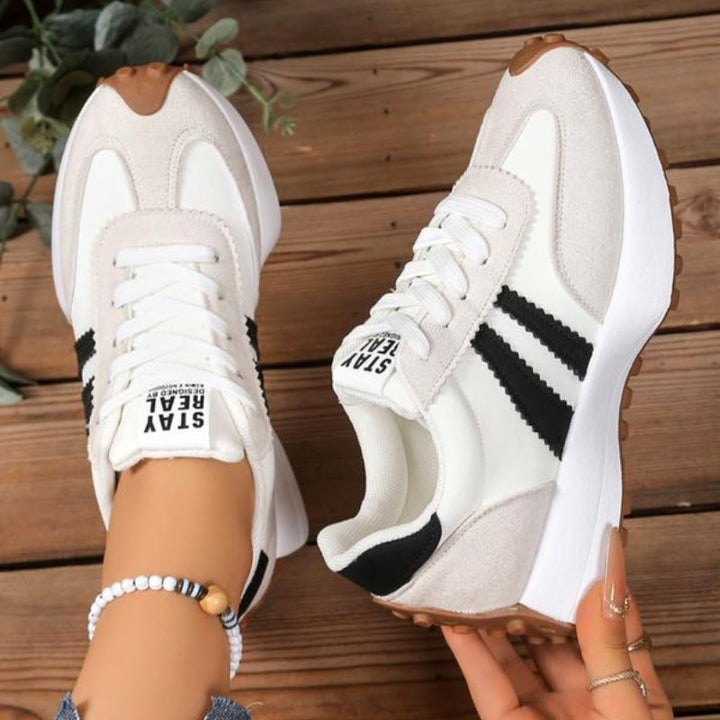 Fashionable women's retro platform trainers, combining vintage style with modern comfort for versatile casual footwear.