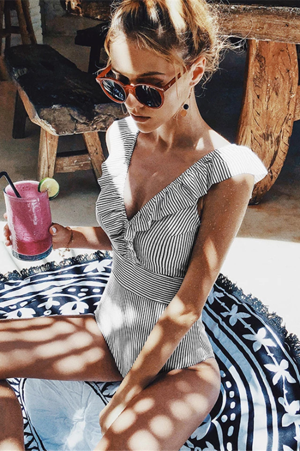 Women's retro striped swimsuit, perfect for summer beachwear. Stylish bathing suit for poolside fashion.