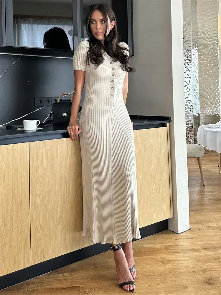 Autumn-ready long ribbed knit V-neck maxi dress for women, featuring chic button accents.