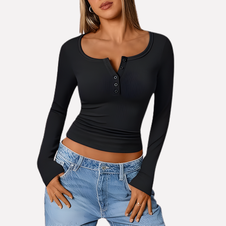 Close-up of a women's ribbed knit long sleeve Henley, showing button placket detail.