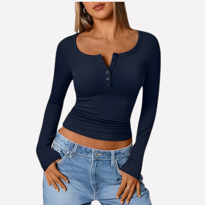 Model wearing a women's ribbed long sleeve Henley top, showcasing its casual, versatile style.