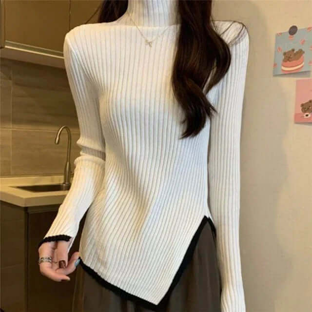 Stylish women's fall fashion ribbed turtleneck sweater with elegant flared sleeves and an asymmetrical hem.