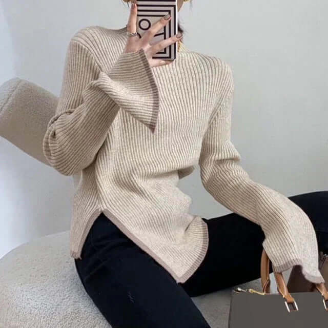 Warm women's winter wear ribbed turtleneck sweater with long flared sleeves, a chic and cozy knit top.
