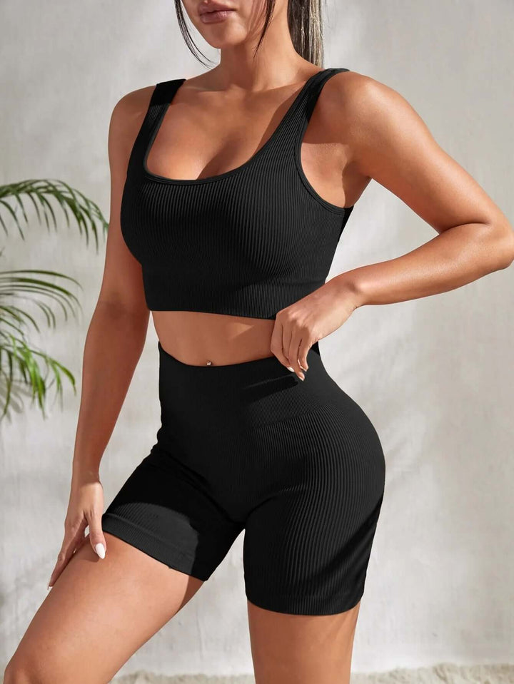 Athletic women's ribbed workout set showing a streamlined fit; perfect gym clothes for active performance and style.