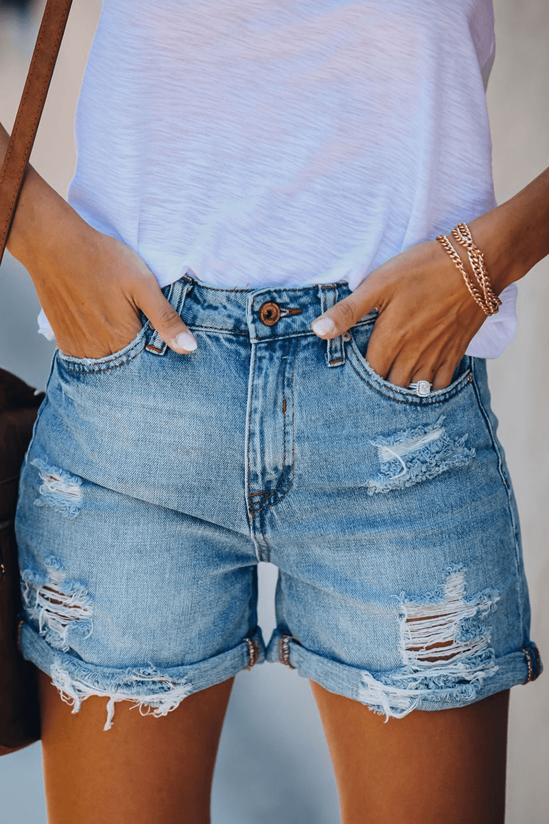 Women's ripped denim shorts with stylish fringes, perfect for summer fashion & casual wear.