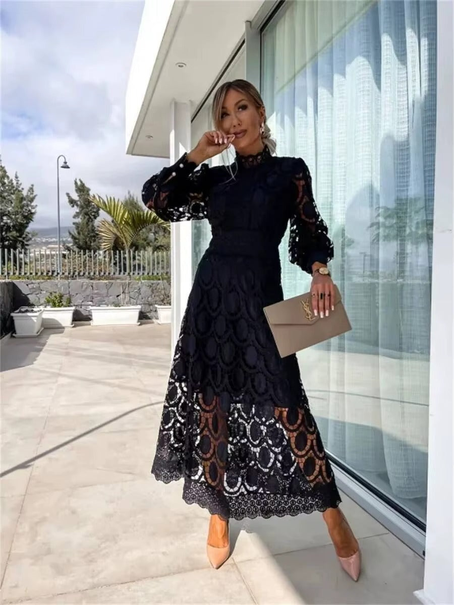 Chic women's party maxi dress with a romantic flowy design. High neck, long sleeve, summer fashion.