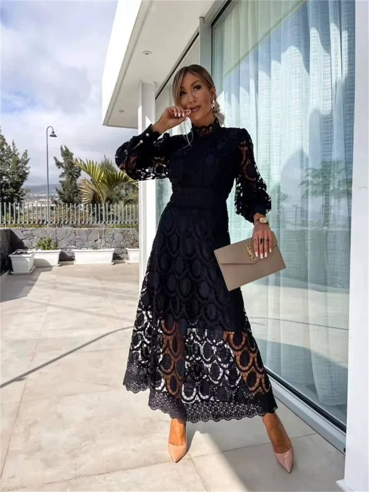 Chic women's party maxi dress with a romantic flowy design. High neck, long sleeve, summer fashion.