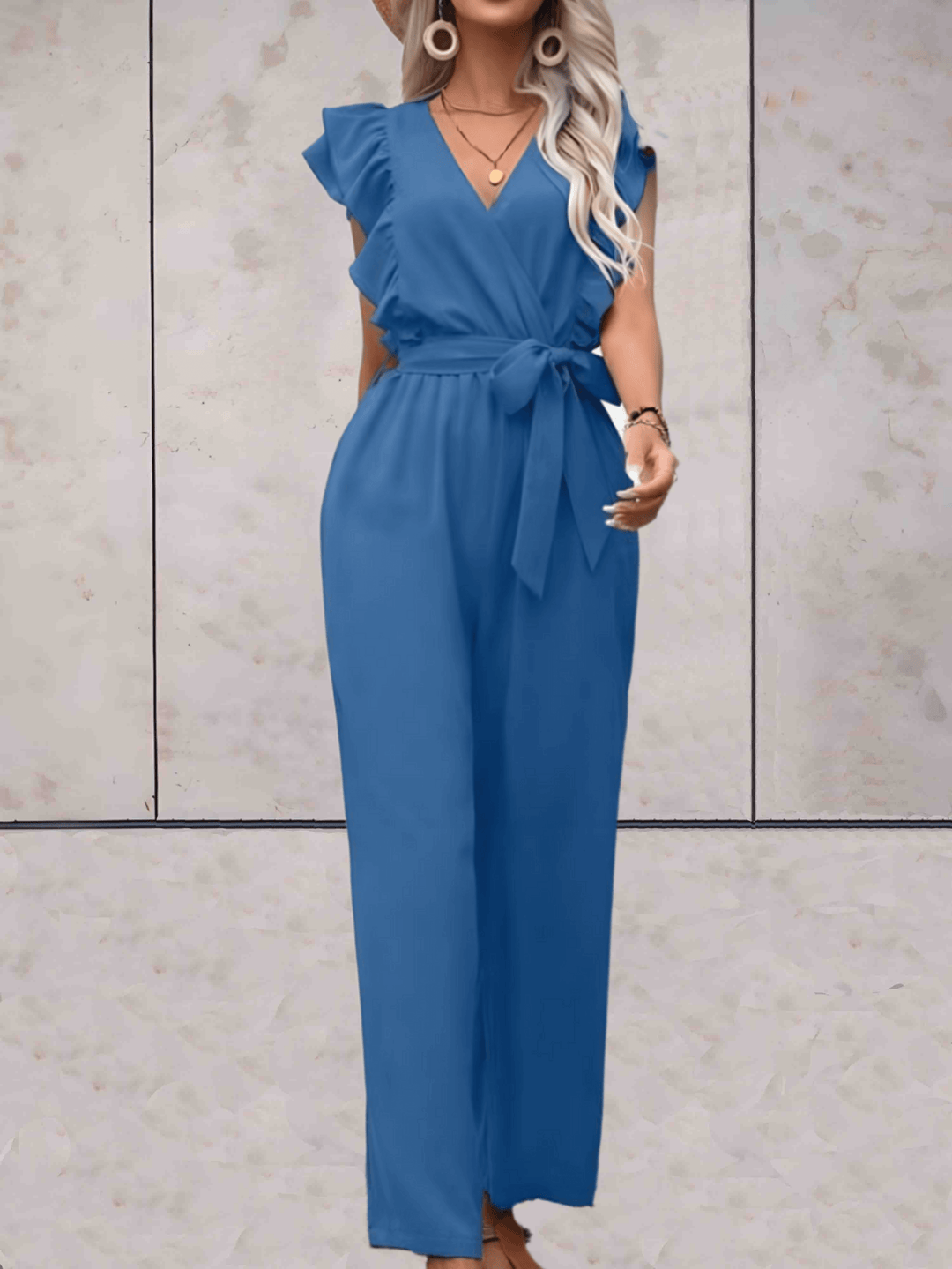 Trendy women's fashion jumpsuit, featuring a V-neck and stylish ruffle short sleeves, made of polyester.