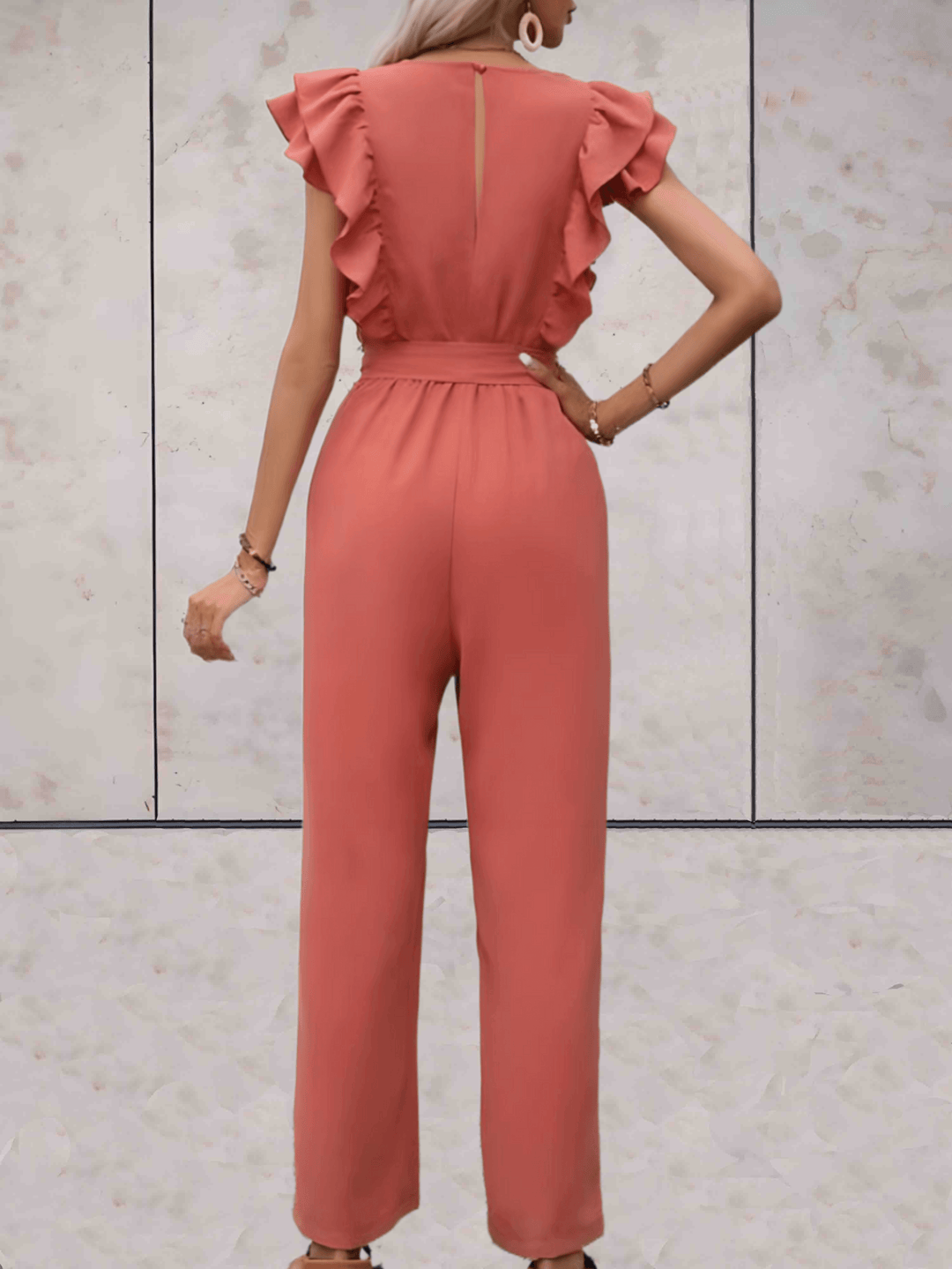 Professional yet stylish women's V-neck jumpsuit with subtle ruffle sleeves, great for office wear.