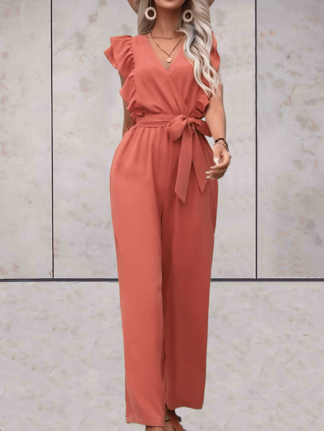 Effortless women's one-piece V-neck jumpsuit with elegant ruffle sleeve details, easy to dress up.