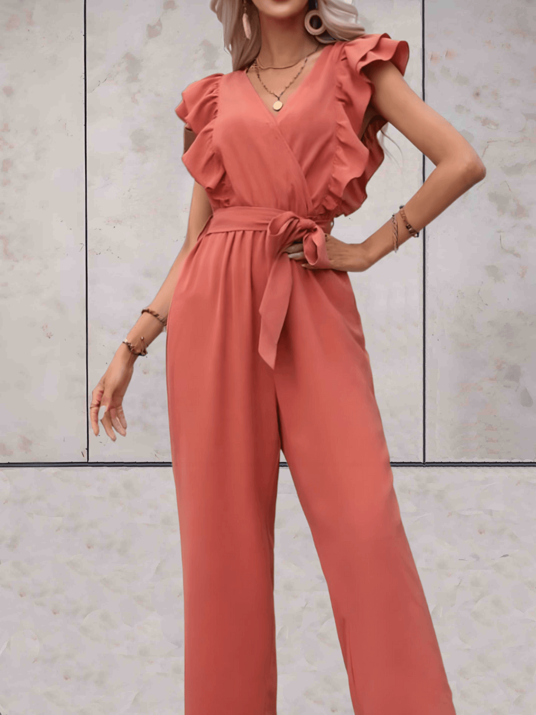 Women's V-neck ruffle sleeve jumpsuit, a fashionable and versatile choice for modern wardrobes.
