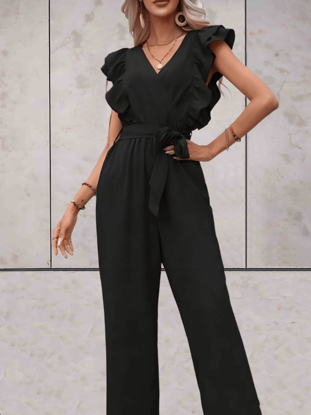 Comfortable polyester women's jumpsuit featuring chic ruffle sleeves and a flattering V-neck.
