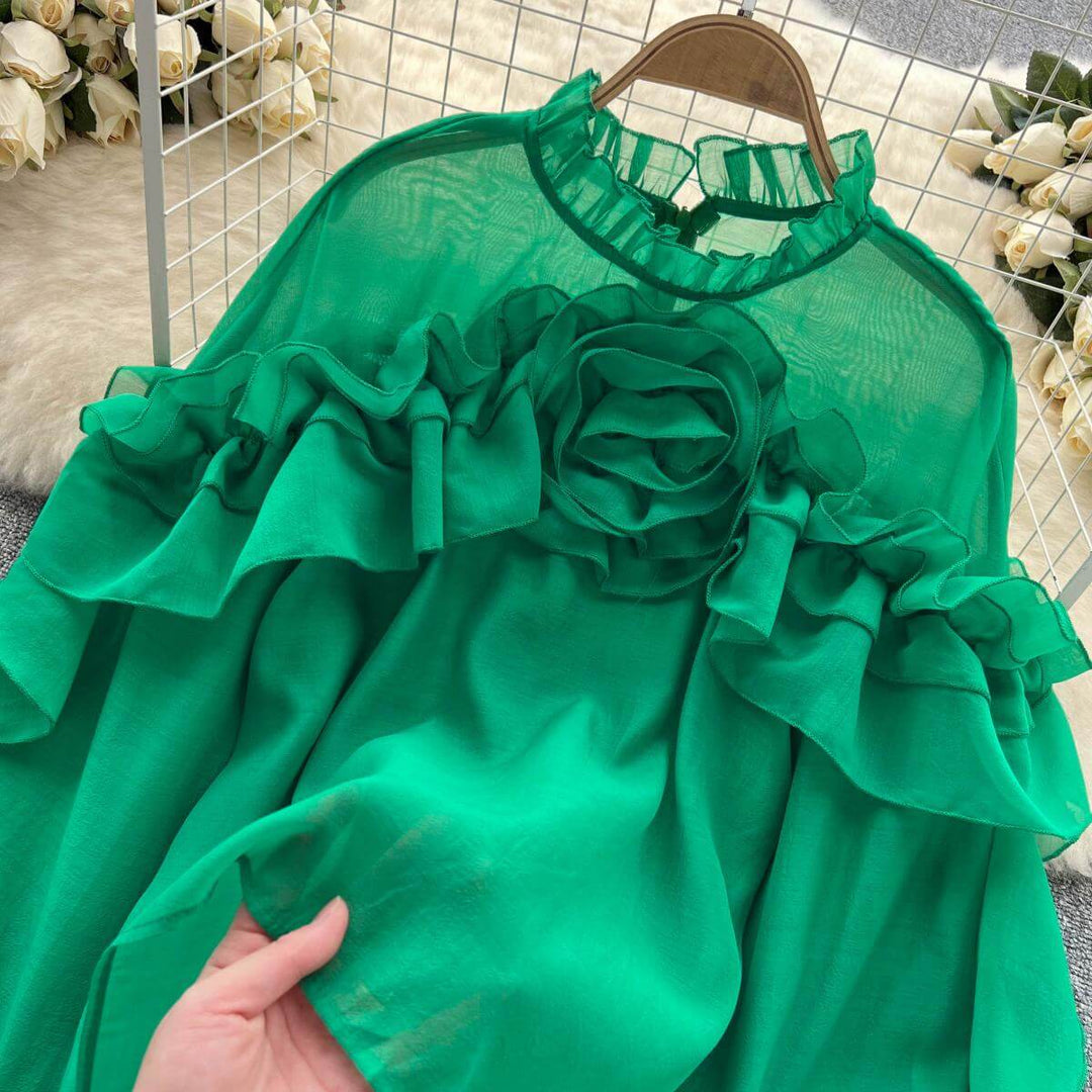 Elegant women's knit sweater featuring delicate ruffles and long sleeves. A cozy, versatile top for chic style.