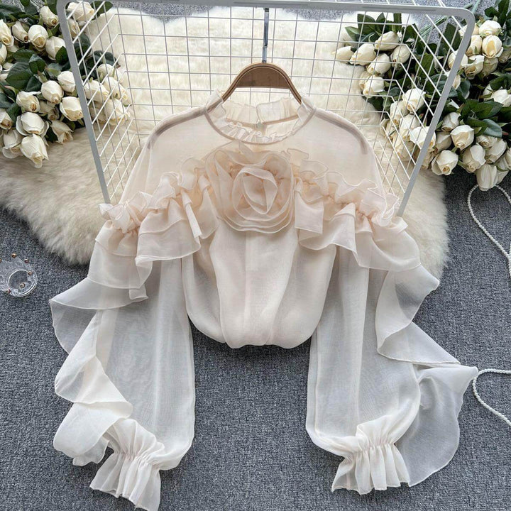 Fashionable women's ruffled knit sweater, a chic long-sleeve top for effortless style in fall & winter.