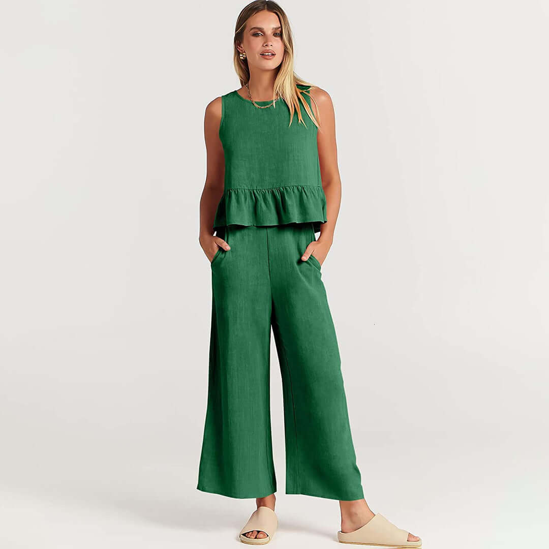 Elegant women's sleeveless ruffled top paired with wide-leg pants, perfect for spring fashion.