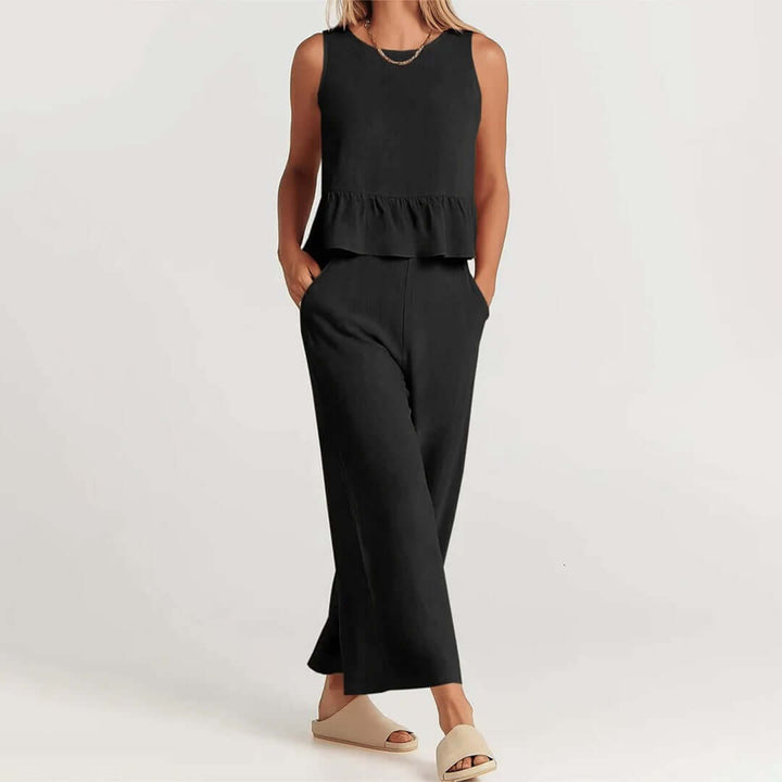 Women's spring/summer fashion set with a chic ruffled top & trendy wide-leg pants.