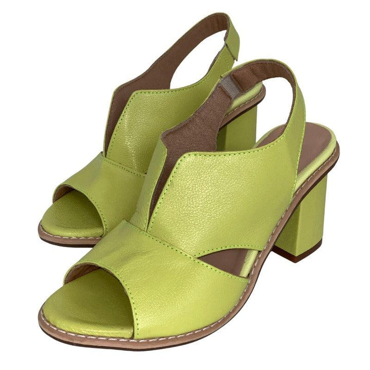 Women's Selina heeled leather sandals on model. Demonstrates elegant fit & everyday style.