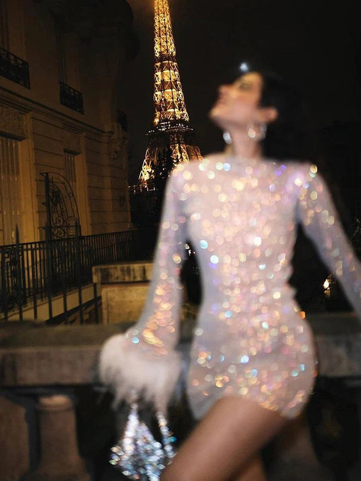 Women's long sleeve shimmering party mini dress with eye-catching feather cuffs for a glamorous look.