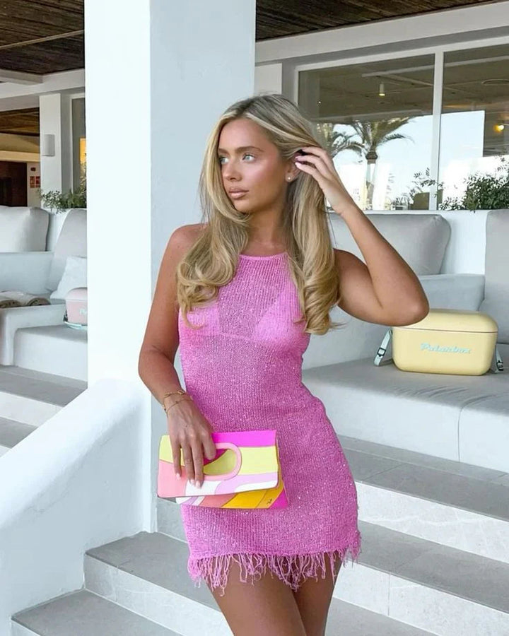 Sparkling women's party mini dress, full sequin coverage for a shimmering and glamorous night out look.