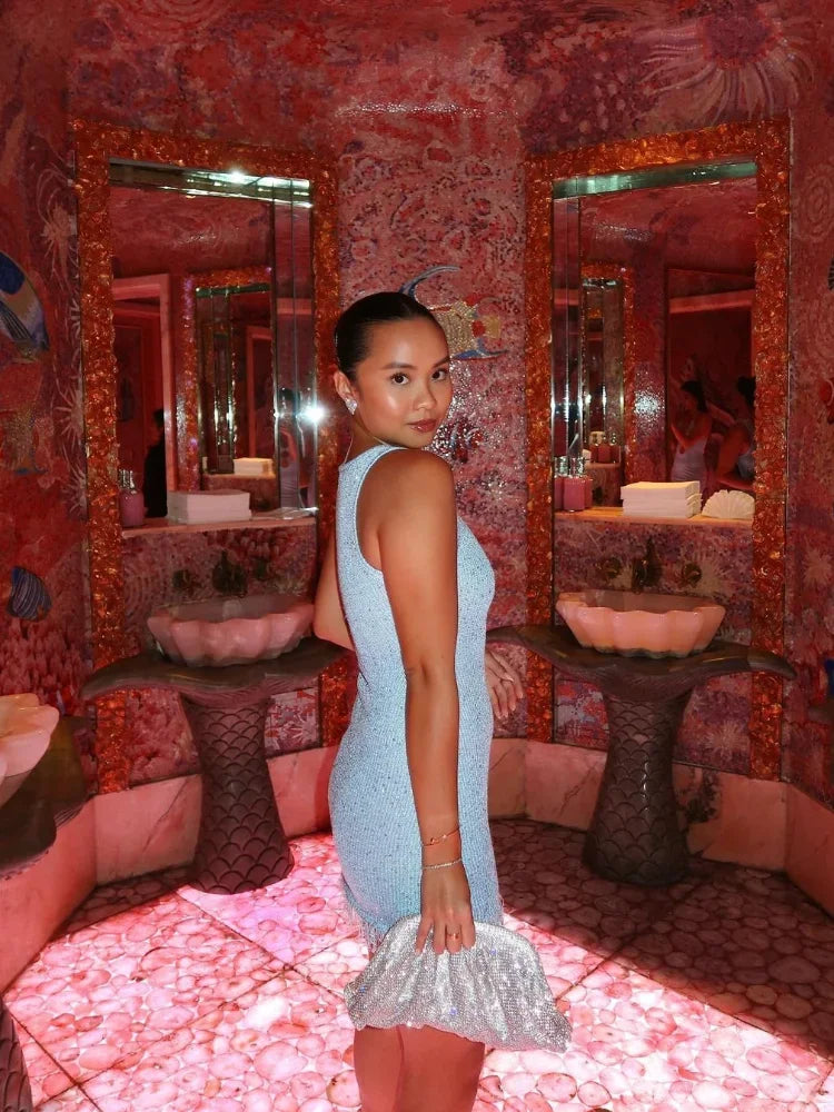 Women's elegant sequin mini dress, a glamorous party and cocktail attire with a beautiful shimmer effect.