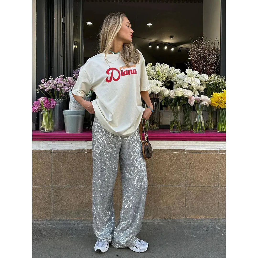 Glittering women's sequin pants, ideal for a festive party, glamorous evening event, or holiday outfit.