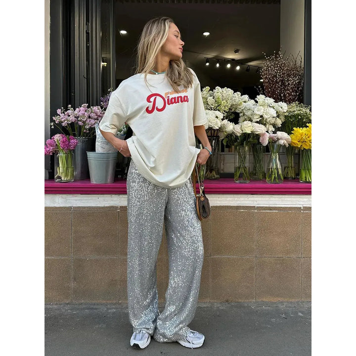 Glittering women's sequin pants, ideal for a festive party, glamorous evening event, or holiday outfit.