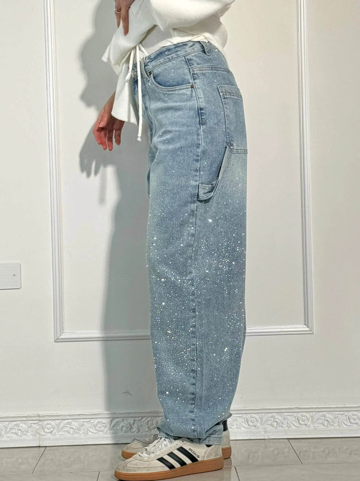 Unique women's shiny balloon carpenter jeans, offering a relaxed fit and statement sparkle for modern style.