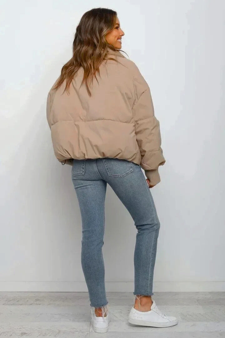 Chic women's zip-up short puffer jacket, quilted design, ideal for daily wear & layering.