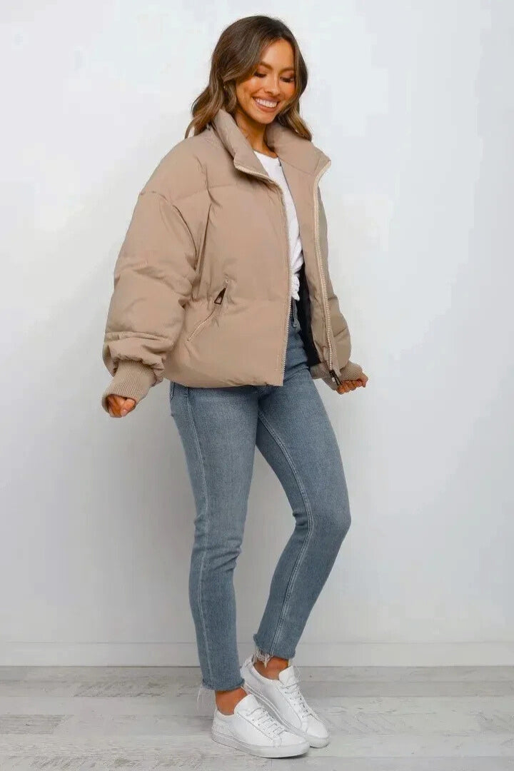 Modern women's quilted short puffer jacket, full zip, stylish outerwear for winter fashion.