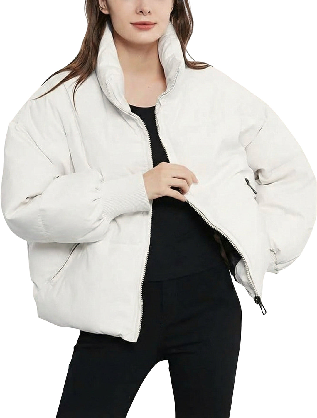Fashionable women's short, zip-up quilted puffer jacket, offering a chic look for winter outings.