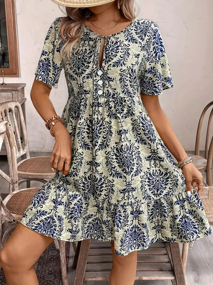 Women's tie neck short sleeve mini dress. Stylish and comfortable for summer parties & casual events.