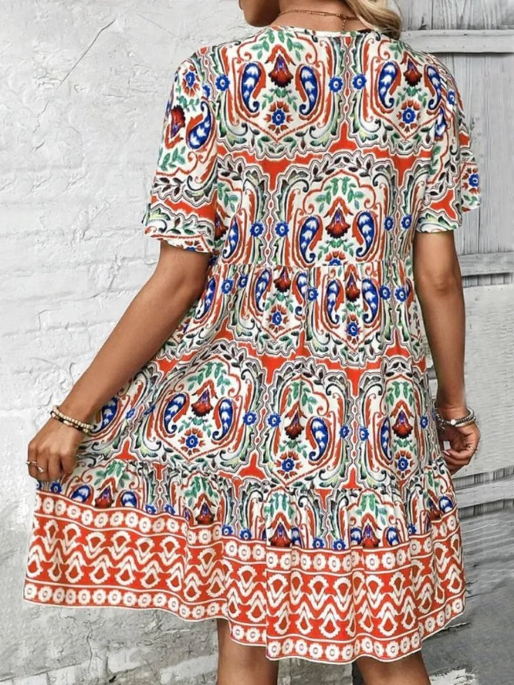 Stylish women's summer mini dress with tie neck. Short sleeves, perfect for parties or daytime elegance.