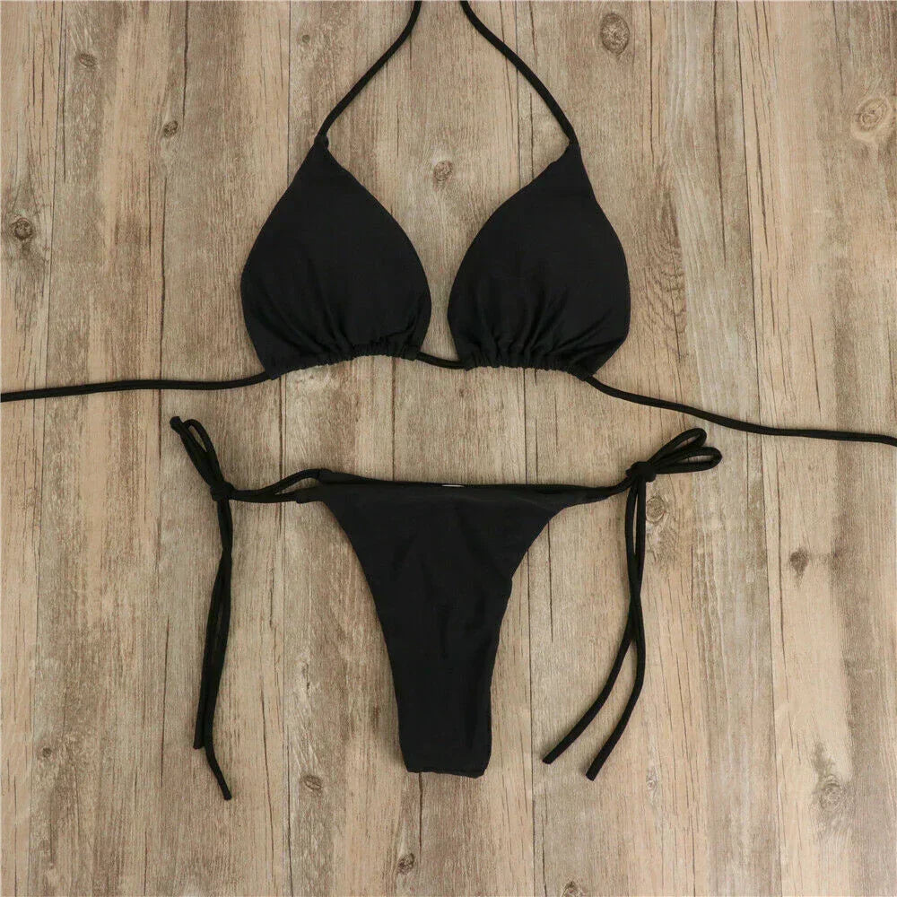 Woman wearing an adjustable side-tie bikini, ready for a stylish day at the beach or pool.