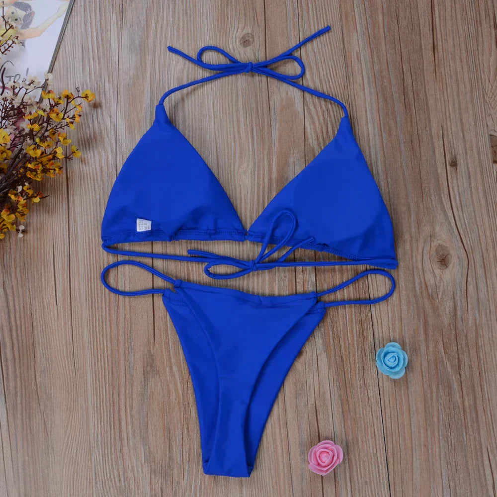 Close-up of a vibrant women's side-tie bikini, highlighting the adjustable design & quality fabric.