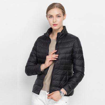 Warm women's winter puffer jacket. Sleek quilted design with stand collar & full zip-up for ultimate comfort.