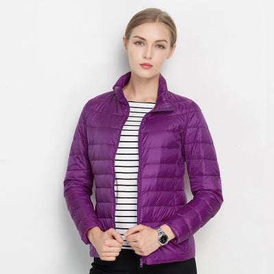 Versatile women's quilted puffer, great for layering. Features a chic stand collar and easy zip-up design.