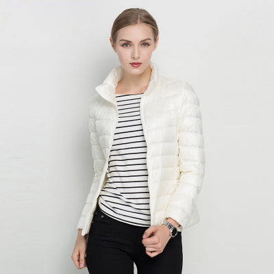 Elegant women's sleek quilted puffer jacket. Stand collar, full zip. Ideal winter coat & fall fashion outerwear.