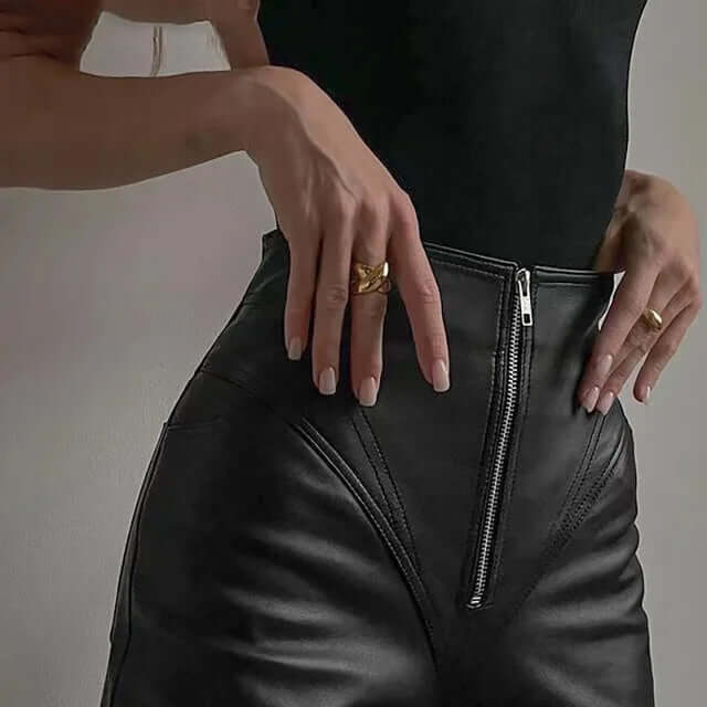 Women's sleek faux leather pencil pants, slim fit for a modern and flattering look.