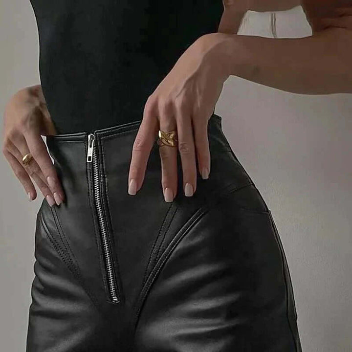 Modern women's slim fit faux leather pants, a sleek pencil cut for a chic and flattering silhouette.