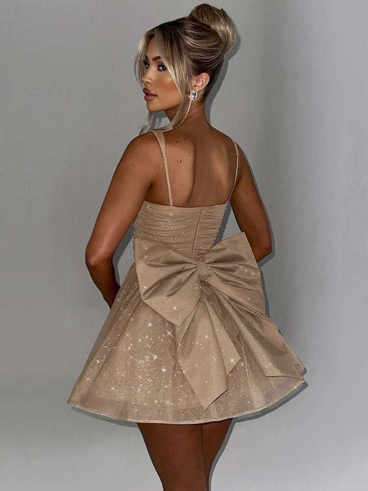 Chic women's A-line cocktail dress, sleeveless, featuring a charming bow, ideal for elegant parties & events.