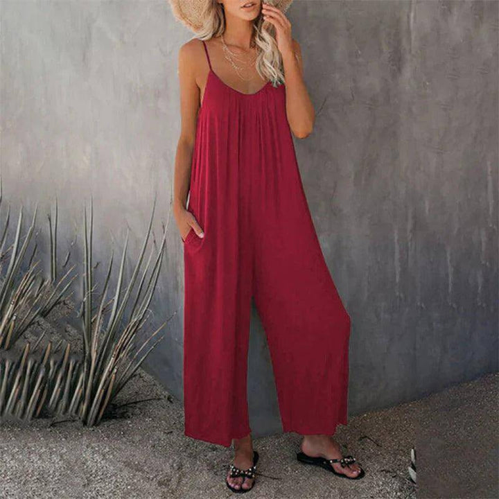 Women's sleeveless loose jumpsuit with pockets. Comfortable, stylish, ideal for casual summer outfits. Versatile fashion piece.