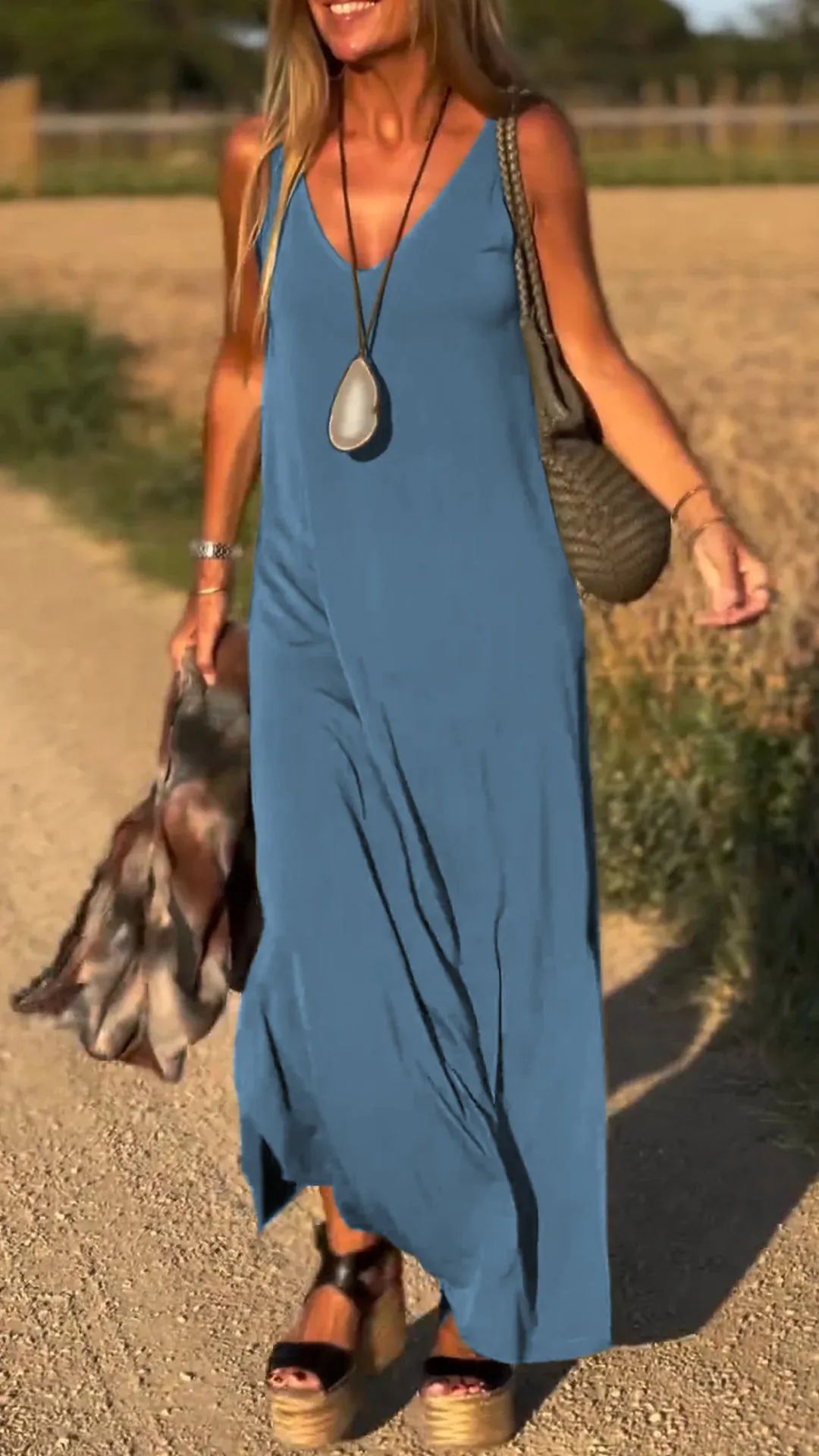 Women's long multi-color dress, sleeveless & elegant, for chic summer adventures.